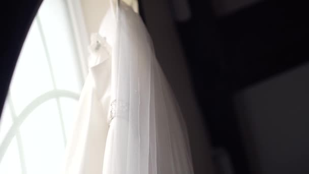 Close Side Shot Beautiful Wedding Dress Hanging Large Window Sill — Stockvideo