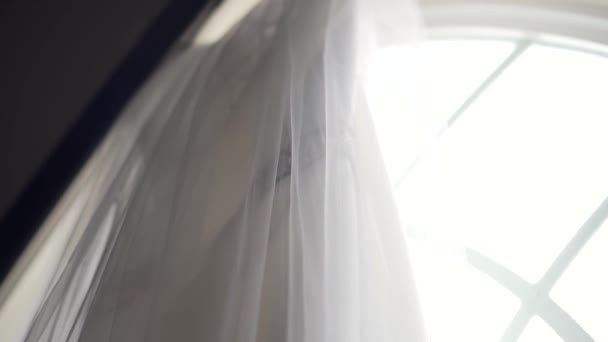 Side Angle Shot Beautiful Wedding Dress Hanging Large Church Window — Video Stock