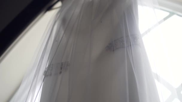 Close Shot Beautiful Wedding Dress Hanging Large Church Window Sill — Wideo stockowe