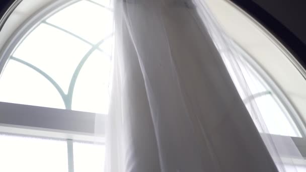 Slow Pan Downwards Beautiful Wedding Dress Hanging Large Window Sill — Stock videók