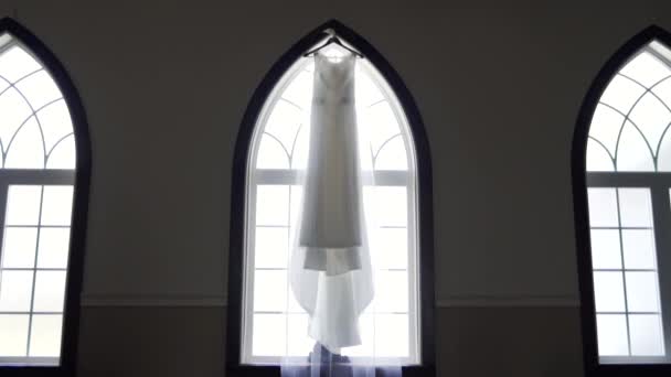 Wide Vista Bride Beautiful Wedding Dress Hanging Large Window Sill — Video Stock