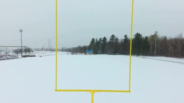 Drone Footage Going Straight Goal Posts Snowy Football Field — Stock videók