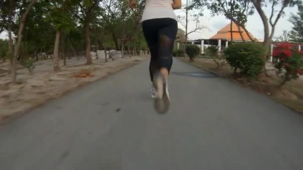 Slowmotion Follow Shot Young Thai Girl Jogging Local Park Shot — Stockvideo