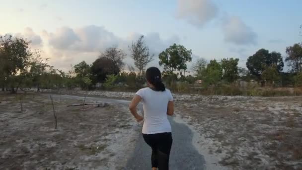 Slowmotion Follow Shot Young Thai Girl Jogging Park Sunset Thailand — Vídeos de Stock
