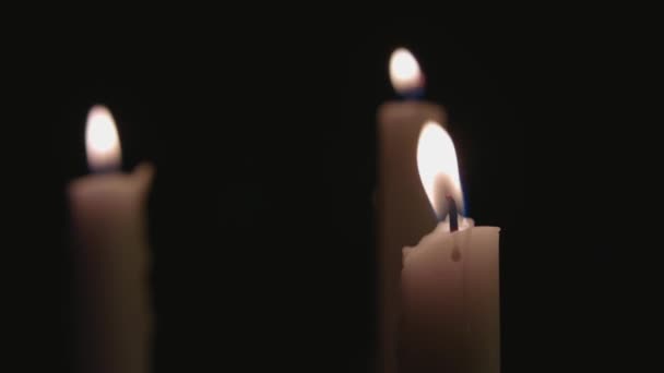 Four White Candles Lit Fast Pan Them — Vídeos de Stock