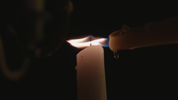 Lone White Candle Being Lit Another Candle Dripping Wax Slow — Vídeos de Stock