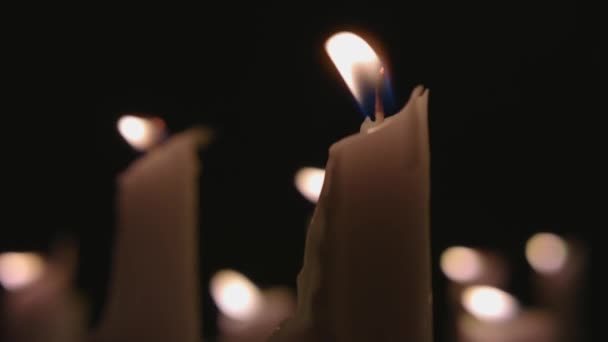 Extreme Close White Candles Lit Black Background Slow Motion — Stockvideo