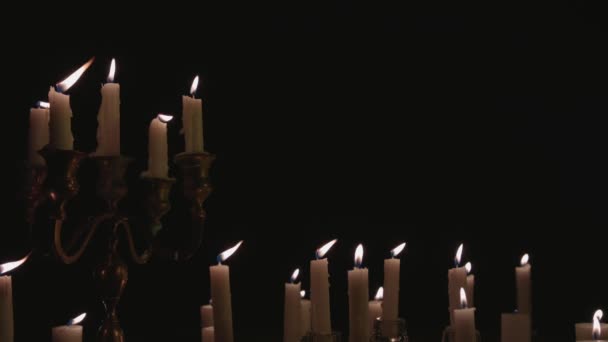 Group White Candles Some Candelabra Lit Running While Great Background — Vídeo de stock