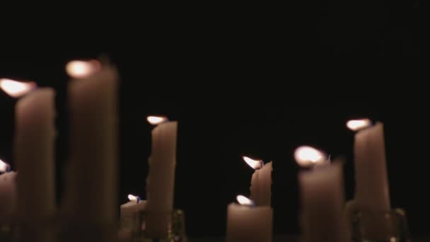 Extreme Close White Candles Lit Black Background Slow Motion — Stockvideo