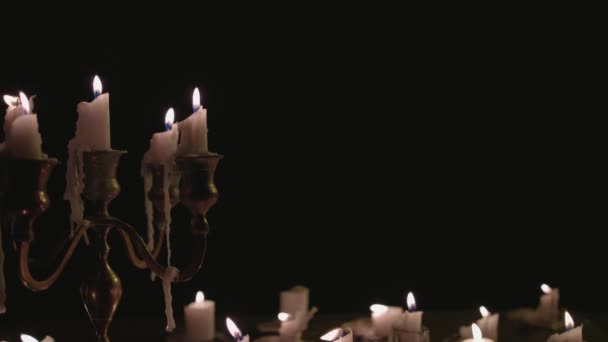 Group White Candles Some Candelabra Lit Blown Out Wind Slow — Stock video