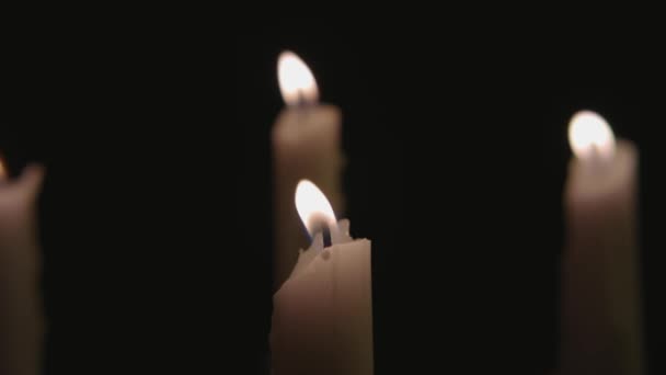 Four White Candles Lit Three Blown Out Wind Slow Motion — Stockvideo