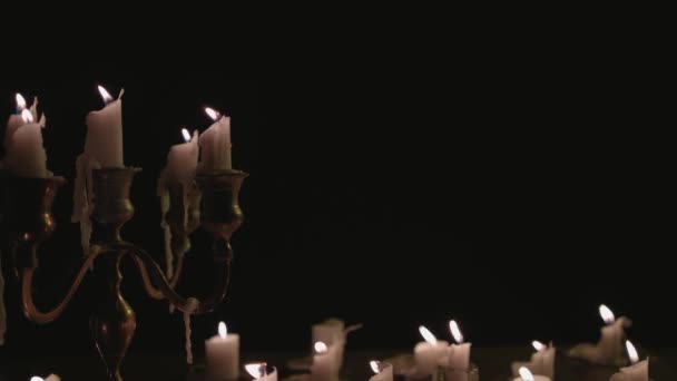 Group White Candles Some Candelabra Lit Running While Great Background — Videoclip de stoc