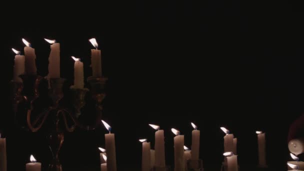 Group White Candles Some Candelabra Lit Running While Great Background — Stockvideo