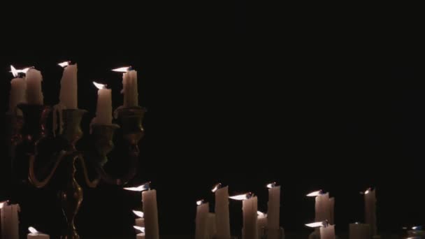 Group White Candles Some Candelabra Lit Blown Out Wind — Stock video