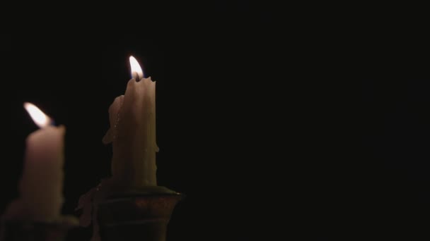 Close Two White Candles Lit Candelabra Being Blown Out Wind — Stockvideo