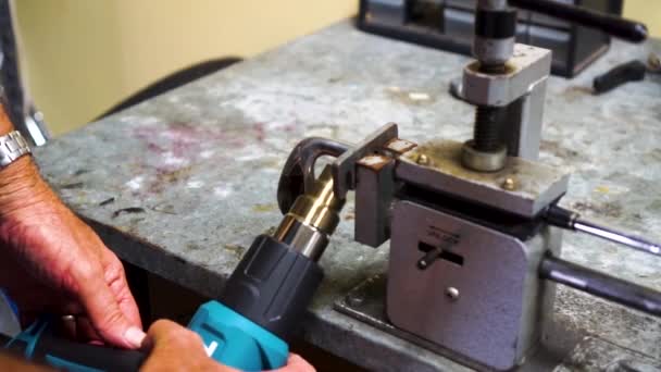 Slow Motion Man Heating Golf Club Head Clamp Vice — Video