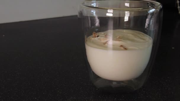 Pouring Muesli Ontop Yogurt Class Cup Slowmotion — Video Stock