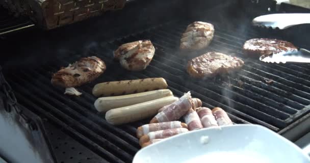 Slowmotion Shot Meat Being Put Gas Grill Sunny Day — Vídeo de Stock