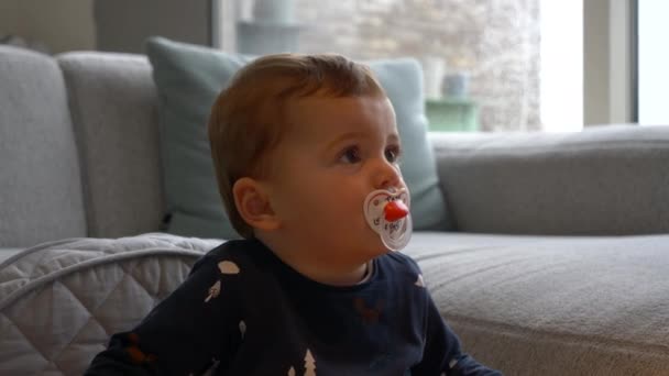 Close Beautiful Baby Boy Pacifier Watching Rainy Day — Stock Video