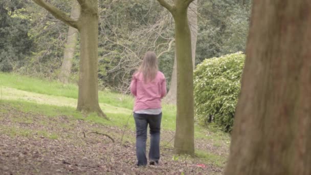 Woman Walks Woodland Trees — Vídeos de Stock