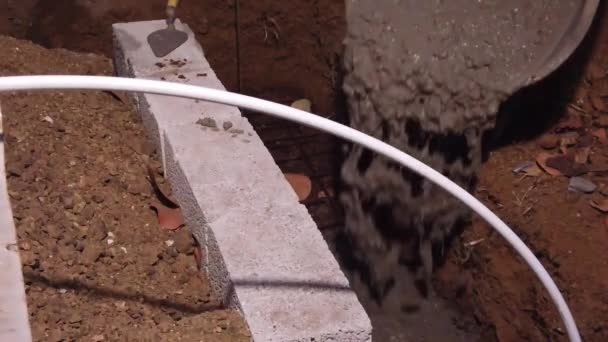 Pouring Cement Ditch Build Foundation House Porch Building Structure — Stockvideo