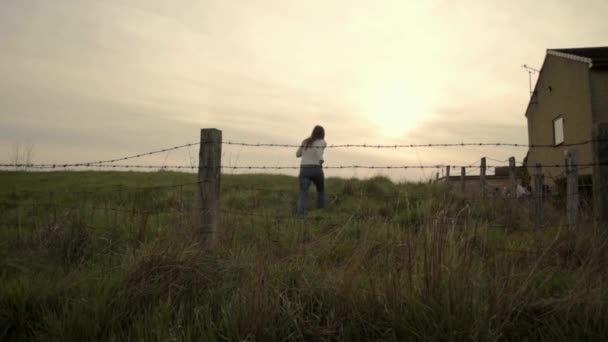 Woman Running Barbed Wire Field — Video