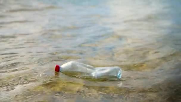 Slow Motion Plastic Bottle Floating Away Clear Shallow Ocean Water — Stockvideo