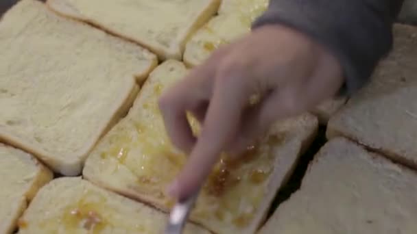 Young Woman Spreading Jam Sandwich Barbecue Lunch — Stockvideo