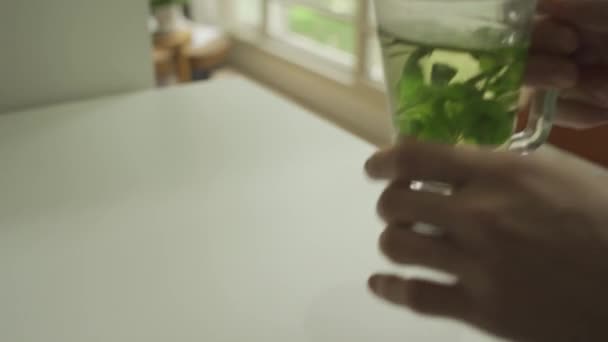 Hands Holding Herbal Tea Table Apartment Man Drinks Puts Back — Stok Video