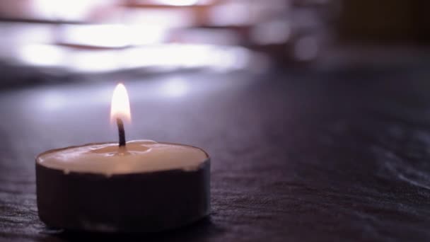 Lit Candle Flickers Background — Vídeos de Stock