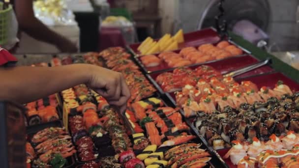 Steady Close Shot People Hands While Buying Japanese Sushi Traditional — 비디오