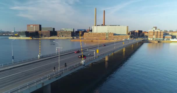 Tracking Aerial Shot Bridge Helsinki Sunset Cars Cyclists Visible Bridge — Stockvideo
