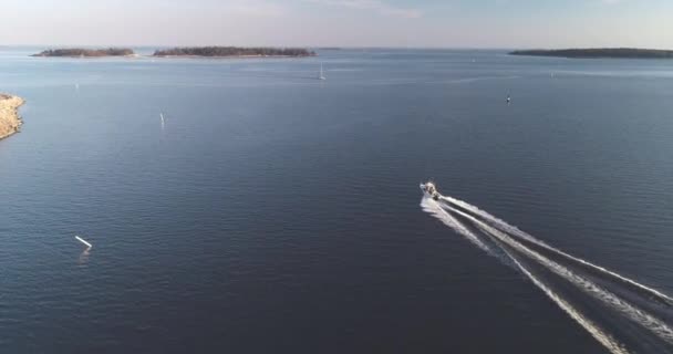 Wide Tracking Aerial Shot Motor Boat Cruising Out Sea — ストック動画