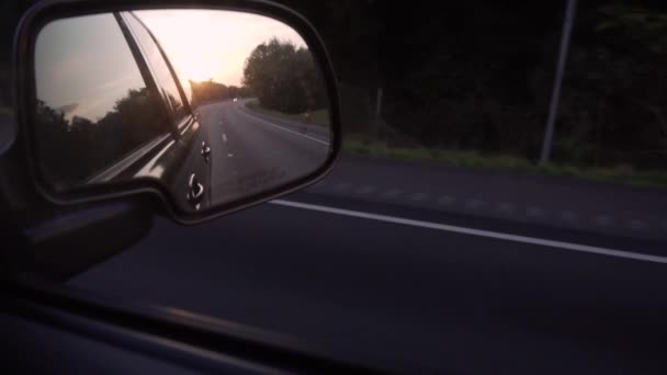 Setting Sun Seen Side Mirror Moving Car Empty Road Rural — Vídeos de Stock