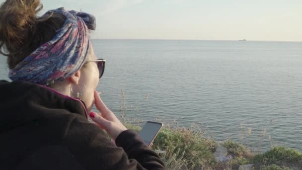 Woman Smoking Cigarette Playing Phone Hill Sea View — Stock Video