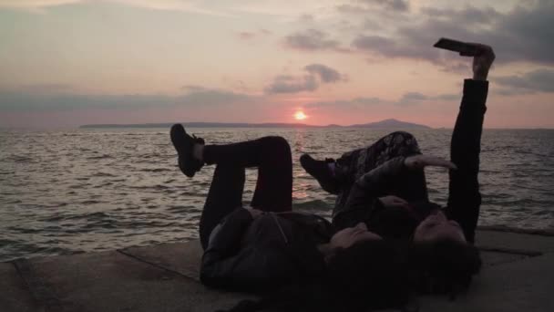 Two Girls Taking Selfie Themselves Sea Sunset — Vídeo de Stock