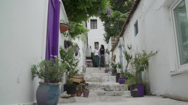 Two Women Walking Narrow Street Bozcaada Island Turkey — Stok video