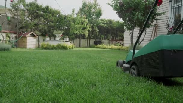 Old Man Mowing Grasses His Lawn Electrical Lawn Mower — Video Stock