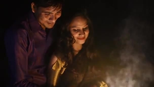 Happy Young Couple Lighting Candles Fire Sparkle Cracker Celebrating New — Stockvideo