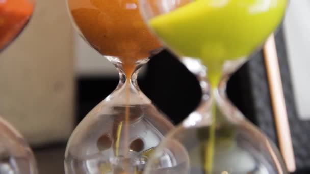 Macro Shot Three Colorful Hourglasses Red Yellow Sand Falling — Wideo stockowe