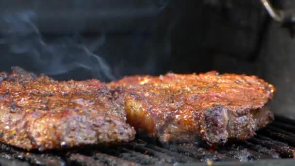 Juicy Rib Eye Steak Sitting Grill Small Orange Flame Next — Stockvideo
