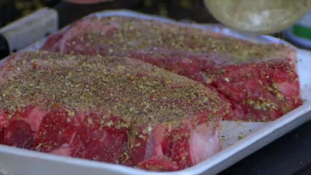 Hand Pours Spices All Already Covered Rib Eye Steak — Stok video