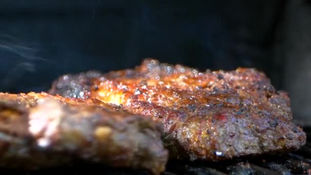 Pair Meat Tongs Turn Nearly Cooked Juicy Rib Eye Steak — Stok video