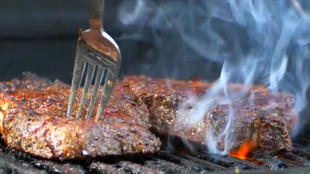 Fork Turns Nearly Cooked Juicy Rib Eye Steak Grill Slow — Vídeo de Stock
