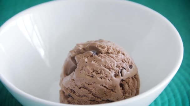 Scoop Chocolate Ice Cream Being Dropped White Bowl — Vídeo de stock