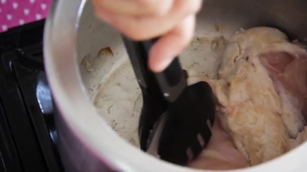 Female Hands Flipping Raw Chicken Breasts Black Pasta Picker Old — Video