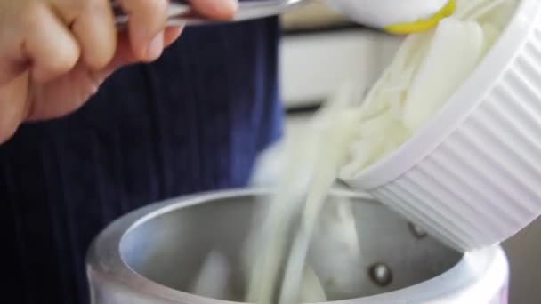 Female Hands Dropping Sliced Onions White Bowl Pressure Pan Spoon — 图库视频影像