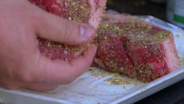 Two Hands Rub Spices Salt Thick Raw Rib Eye Steak — Vídeo de stock