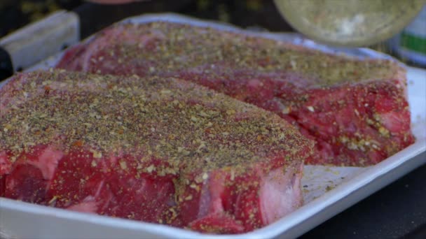Hand Pours Spices All Already Covered Rib Eye Steak Slow — Stockvideo