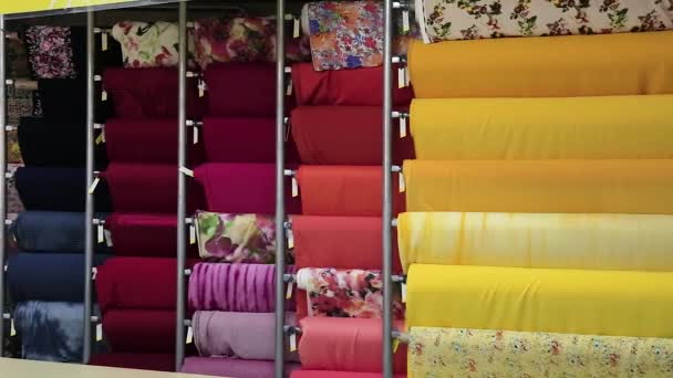 Camera Pan Colorful Big Rolls Cloth Samples Vertically Organized Interior — Stok video